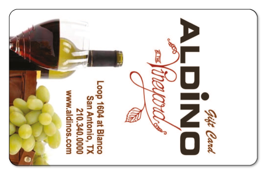 Vertical gift card with an image of wine and grapes with the Aldino logo.